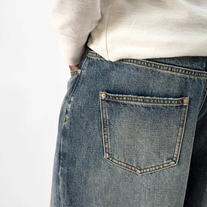 Wide-Leg Blue Denim Jeans with Faded Vintage Wash and Whiskering